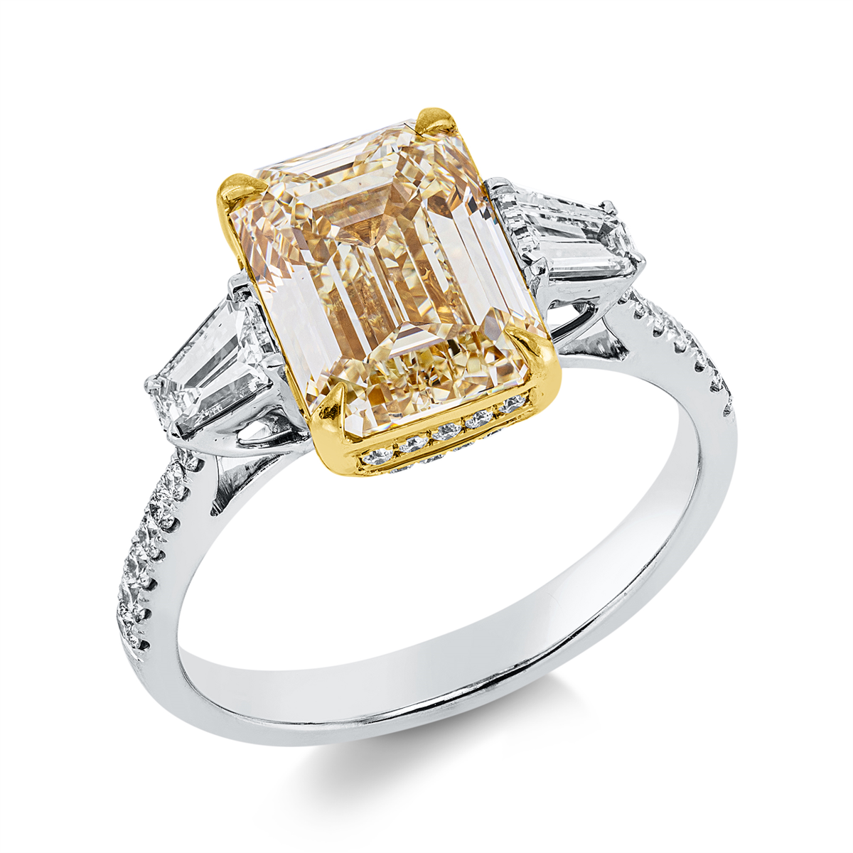 emerald cut fancy colored diamond ring in white gold / yellow gold