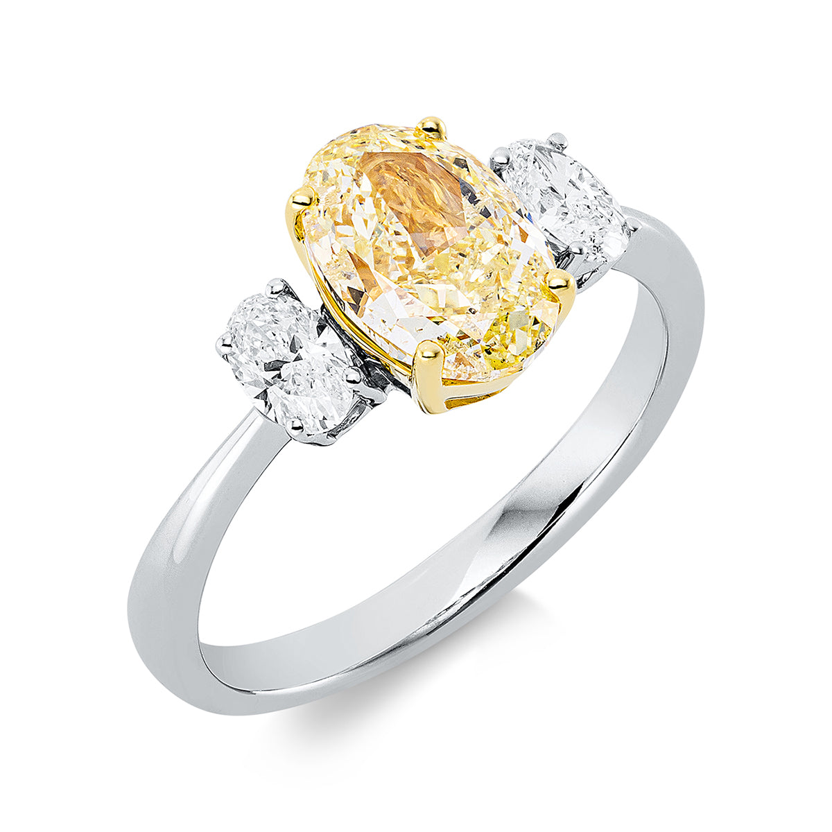 oval  fancy colored diamond ring in white gold / yellow gold