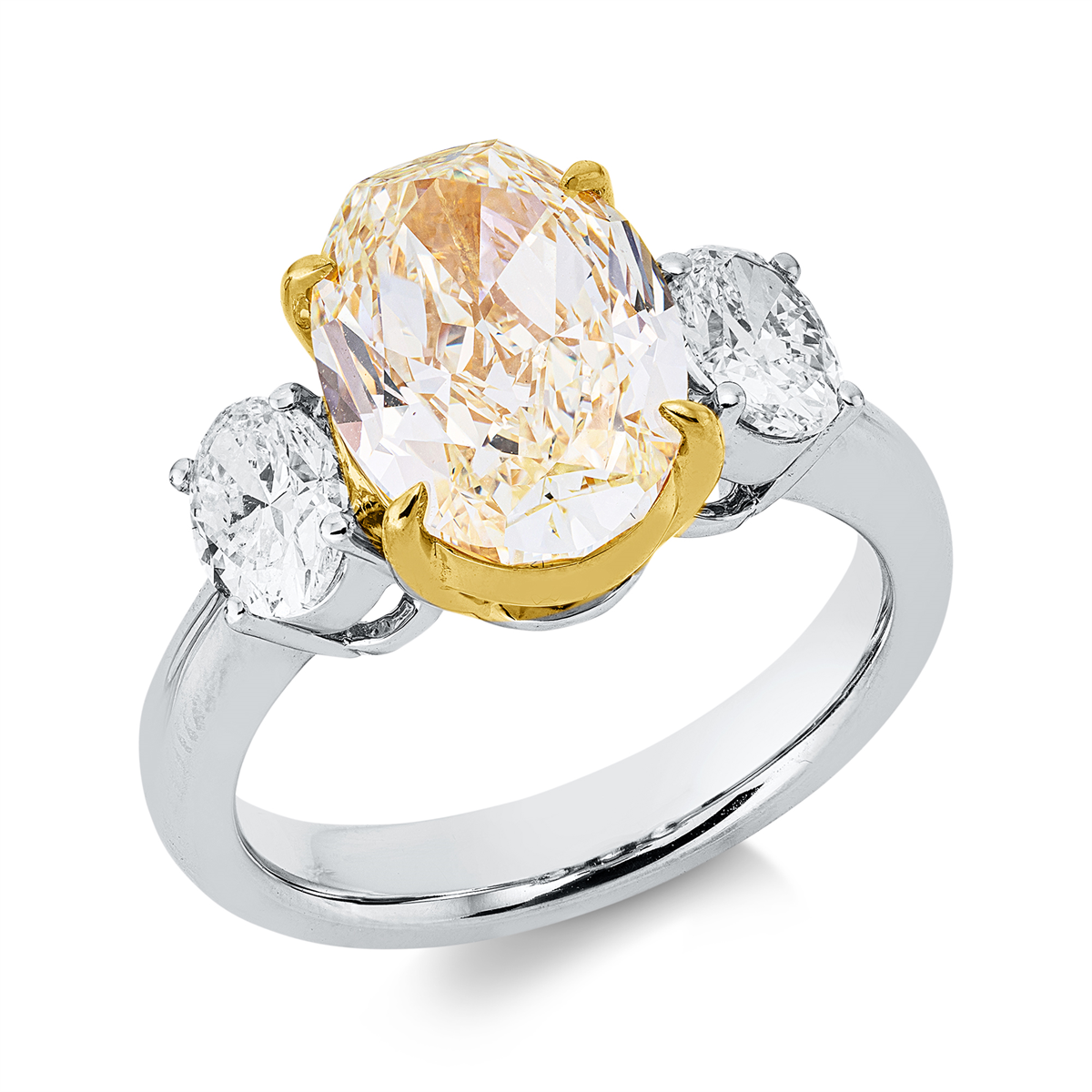 oval  fancy colored diamond ring in white gold / yellow gold