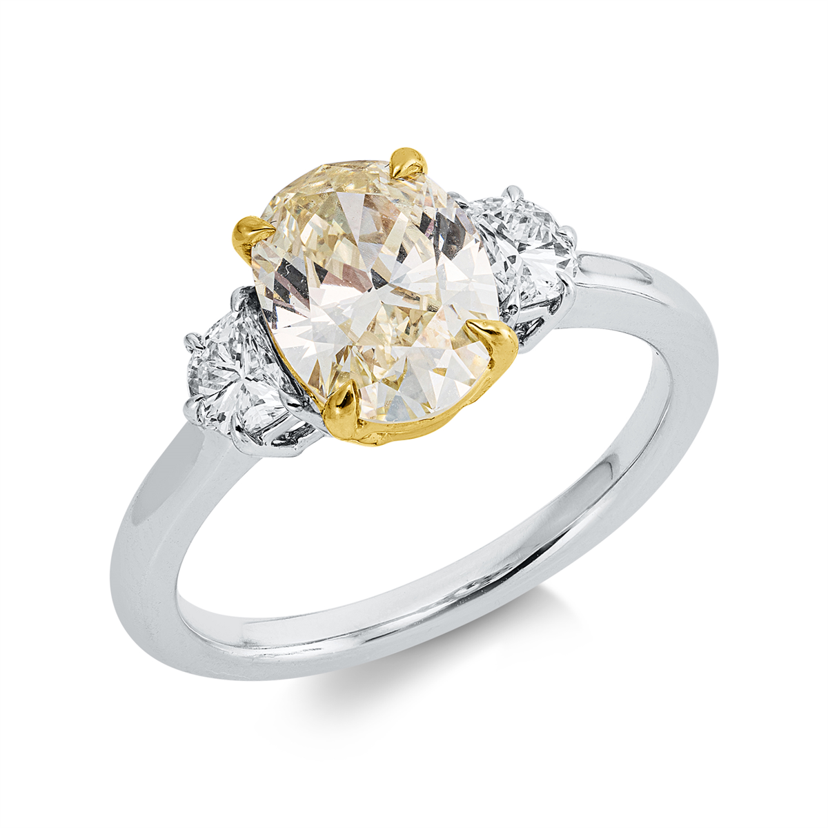 oval  fancy colored diamond ring in white gold / yellow gold