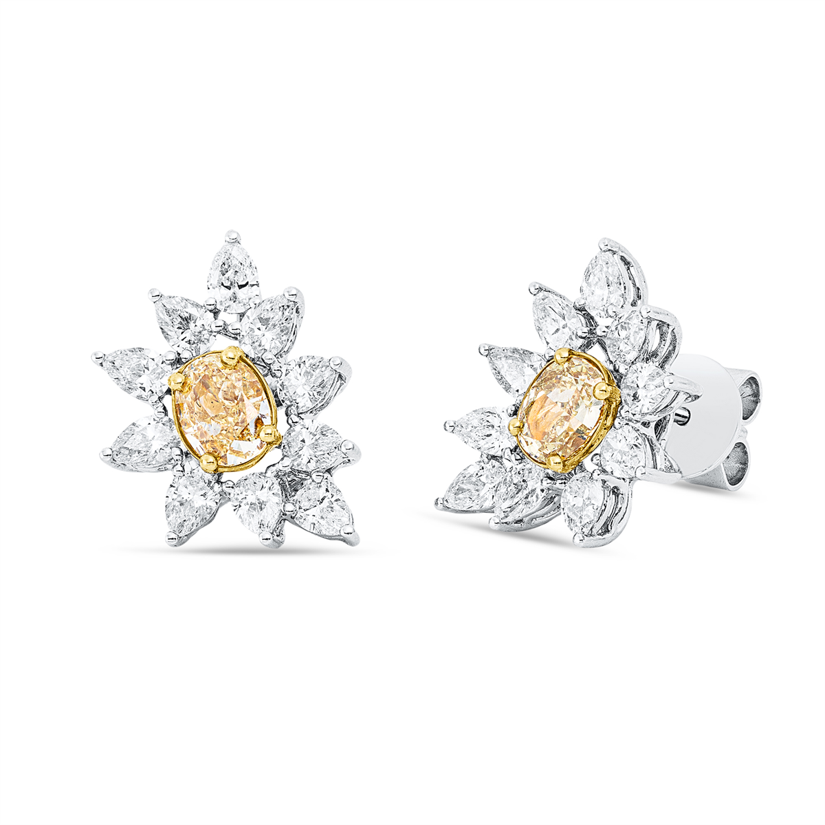 pear shape  fancy colored diamond earrings in white gold / yellow gold